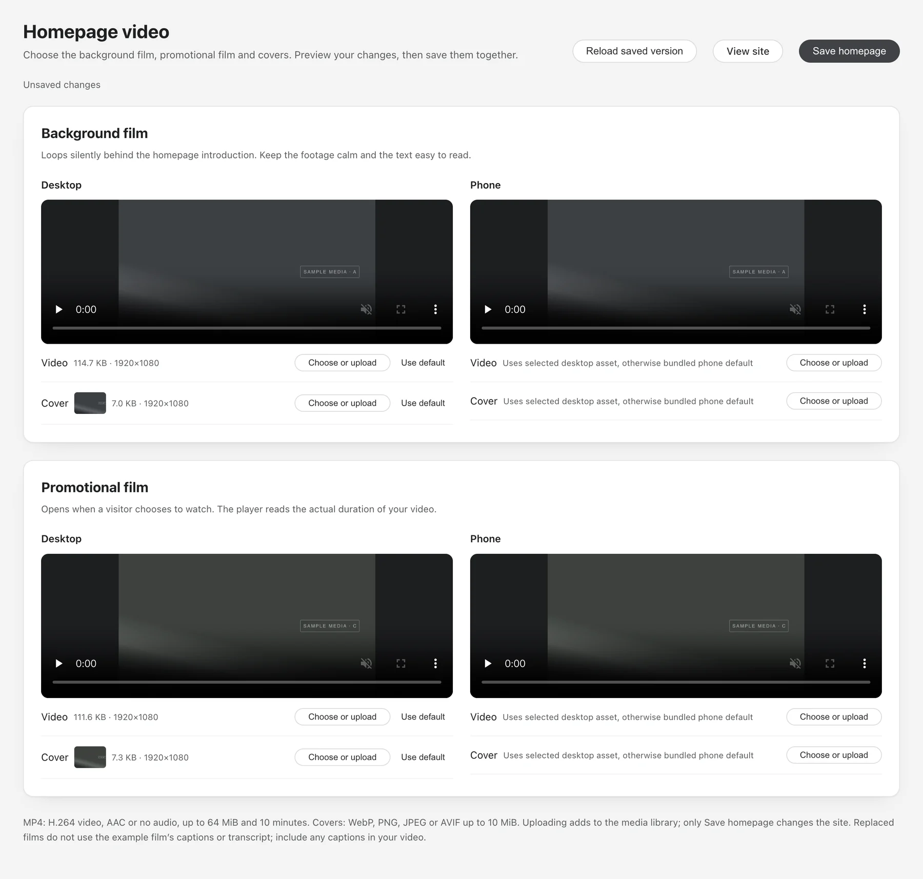 The admin's homepage video settings page. At the top are buttons to reload the saved version, view the site and save the homepage, above a line reading Unsaved changes. Background film and Promotional film each have a section with Desktop and Phone columns; each column has a preview and Video and Cover rows with a “Choose or upload” button. A note at the bottom says uploading only adds to the media library and only saving changes the site.